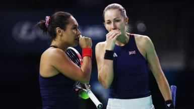  Heather Watson and Olivia Nicholls of Great Britain talk in their doubles match against Viktoria Hruncakova and Tereza Mihalikova