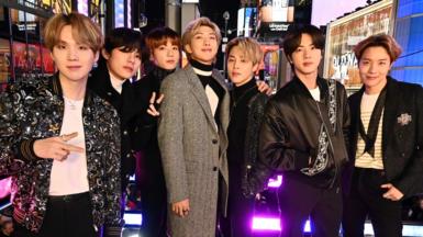BTS pose in Times Square in New York