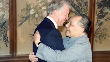 Former US Presidents Jimmy Carter (L) and China's paramount leader Deng Xiaoping hug each other on June 29, 1987 in Beijing.