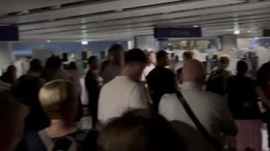 Crowd stuck in darkness at airport