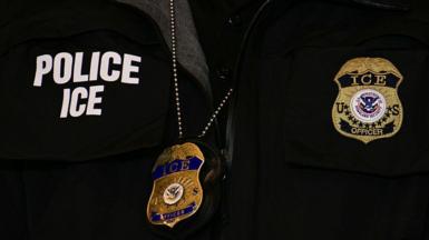 An ICE patch and badge are seen on a Department of Homeland Security agent during remarks delivered by US Vice-President JD Vance at Royalston Square on January 22, 2026 in Minneapolis, Minnesota.