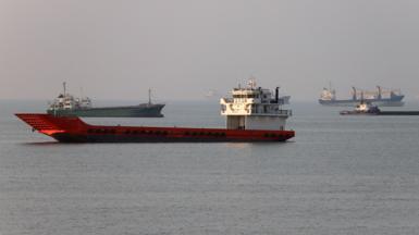 Vessels in the Strait of Hormuz near the beach of Bandar Abbas, Iran, June 21, 2026.