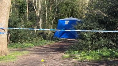 A forensic tent with a police cordon 