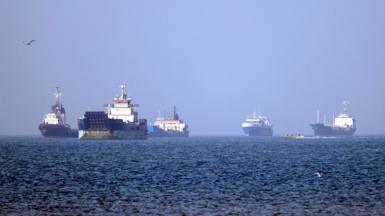Ships in the distance in the Strait of Hormuz.