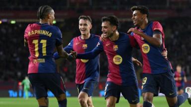 Barcelona players celebrate a goal