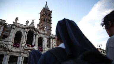 A nun looking up at Santa Maria Maggiore