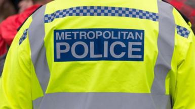 a close up stock image of the back of a uniformed Metropolitan Police officer