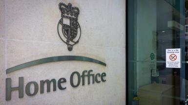 The Home Office logo on the exterior of a Home Office building