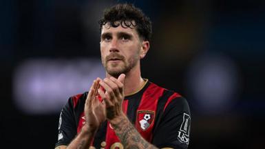 Marcos Senesi applauds Bournemouth fans after a game at Manchester City in November 2025