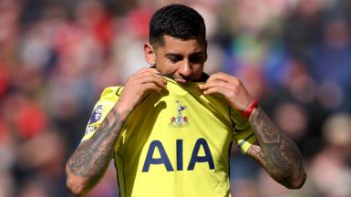 Tottenham's Cristian Romero bites his shirt as he is substituted in their Premier League game against Sunderland