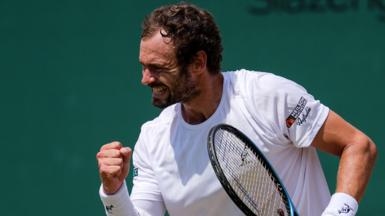 Roman Safiullin celebrates after defeating Joao Fonseca