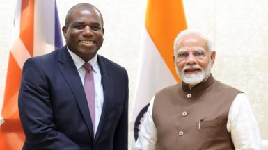 Foreign Secretary David Lammy shakes hands with Indian Prime Minister Narendra Modi