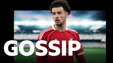 Close-up image of Curtis Jones. He has black hair and is wearing Liverpool's red home shirt.