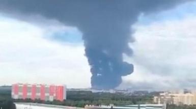 A large plume of smoke rising over Russia