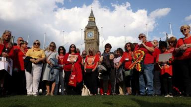 People impacted by the infected blood scandal, campaigning outside the Houses of Parliament
