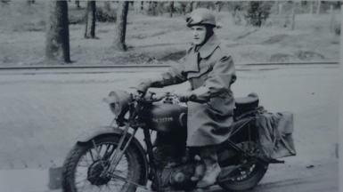 Ralph Fraser riding a motorcycle 