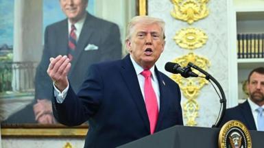 Dpnald Trump speaking to reporters