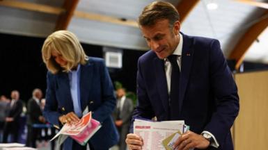 French President Emmanuel Macron and his wife Brigitte Macron vote during the European Parliament election, at a polling station in Le Touquet-Paris-Plage, France, June 9, 2024