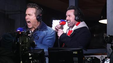 Wrexham owners Ryan Reynolds and Rob Mac celebrate Wrexham’s first goal against Swansea in the gantry