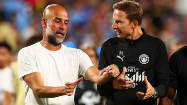 Pep Guardiola and Pep Lijnders talk to each other