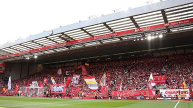 Fans with banners at Anfield