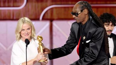Amy Poehler, winner of the Best Podcast Award for "Good Hang With Amy Poehler," and Snoop Dogg speak onstage during the 83rd Annual Golden Globe Awards at The Beverly Hilton on January 11, 2026 in Beverly Hills, California.