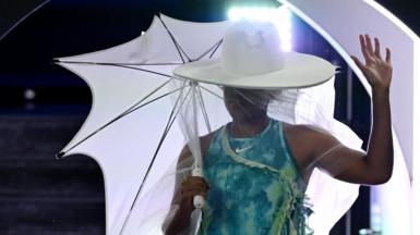 Naomi Osaka walks on to court