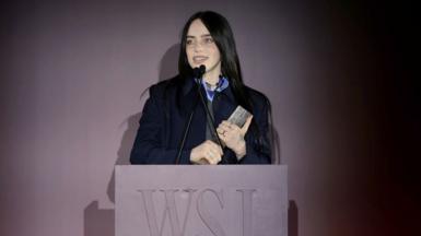 Billie Eilish accepting WSJ award on stage