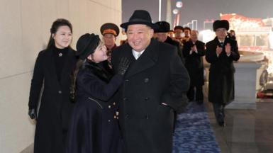 Kim Jong Un attends a military parade with his wife Ri Sol Ju (left) and their daughter Kim Ju Ae (centre)