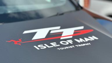 Isle of Man TT logo on the bonnet of an official course car.