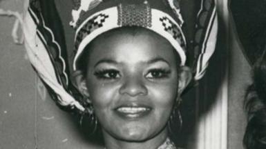 A black-and-white close up image of Cynthia Shange smiling