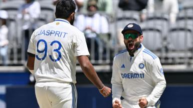 India's Jasprit Bumrah and Virat Kohli celebrate the wicket of Australia's Travis Head