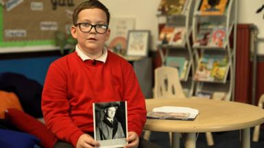 A boy with a photo
