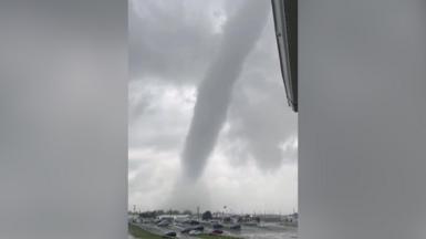 A tornado above a car park.