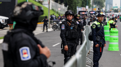 Police near the England team's hotel before their arrival for their World Cup last-16 game with Mexico in Mexico City