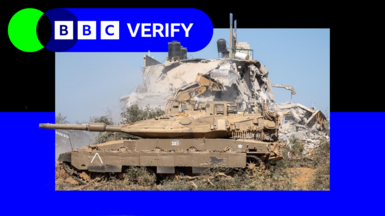 An Israeli tank parked in front of a heavily damaged building in Gaza. The image is imposed over BBC Verify branding and colours. 