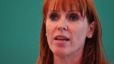 Close up of Rayner against a green background