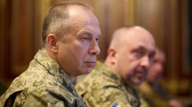 Side view of Syrsky, who is wearing camouflaged military uniform 