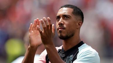Belgium midfielder Youri Tielemans claps towards fans