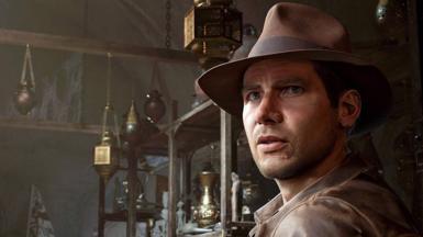 A photo of Indiana Jones taken from a video game with the character wearing a brown hat staring into the distance 