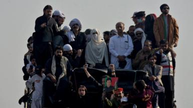 Bushra Bibi, wife of jailed former Pakistani Prime Minister Imran Khan, and supporters of Khan's party Pakistan Tehreek-e-Insaf (PTI) attend a rally demanding his release, in Islamabad, Pakistan, November 26, 2024.