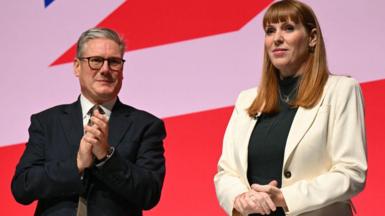 Angela Rayner stands on stage at Labour Party conference in September 2025, while Sir Keir Starmer applauds in the background.