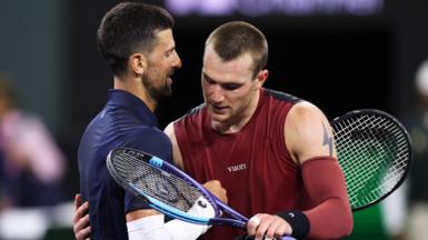 Novak Djokovic and Jack Draper hug at the net after their match at Indian Wells 