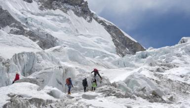 Photo showing five climbers practising at Khumbu Icefalls area before Camp I. 