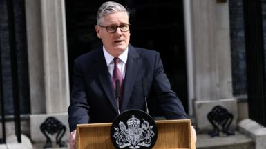 Starmer speaking at a lectern in front of No 10
