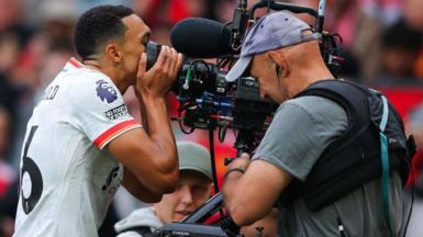 Trent Alexander-Arnold kisses a camera