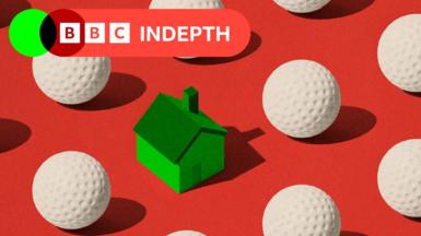 A red background with white golf balls in rows and one green house