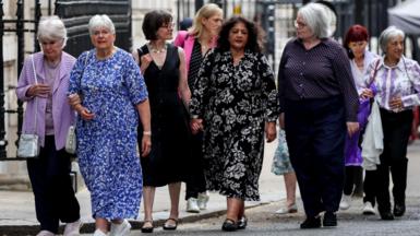 Campaigners arrive for a meeting with Britain's Prime Minister Keir Starmer at Downing Street, to discuss historical forced adoption, 
