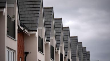 The tops of new build houses standing in a row