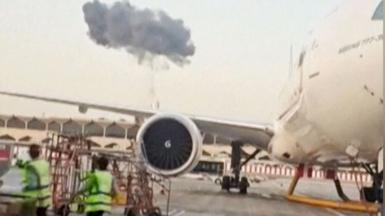 Smoke seen above planes at Dubai International Airport